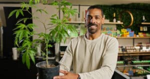 A budtender works inside of a retail cannabis shop in Oregon.